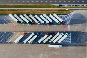 Aerial view of logistics lorries, parked in a car park